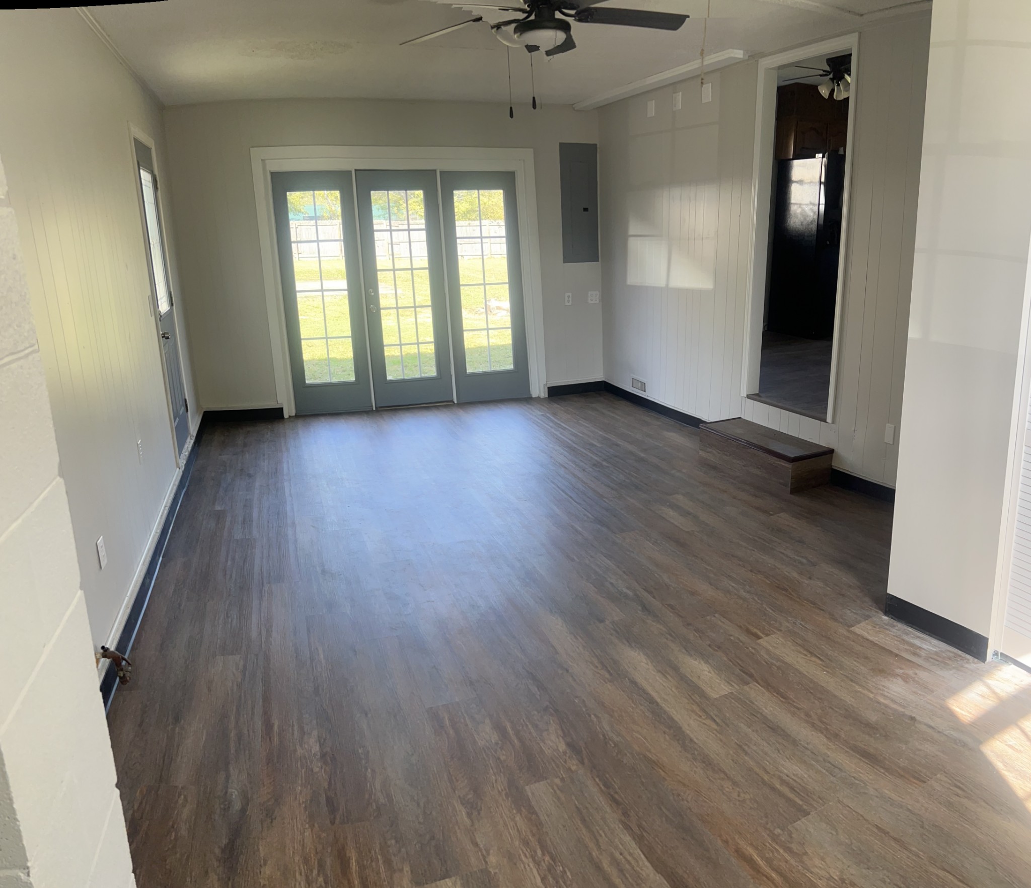 641 Coolidge Road Lafayette, TN 37083 - Photo 14 of 17 an empty room with wooden floor and windows