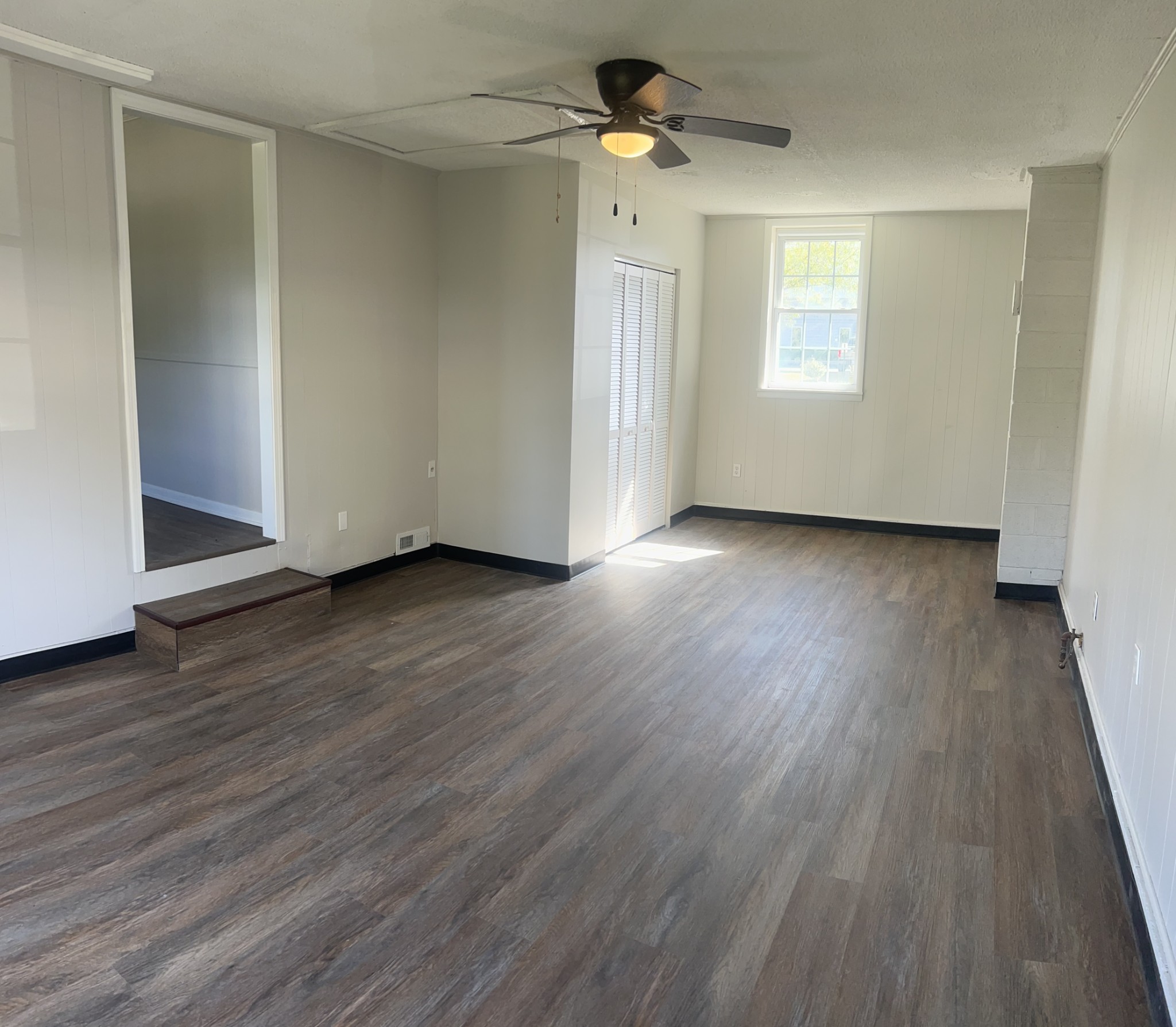 641 Coolidge Road Lafayette, TN 37083 - Photo 16 of 17 a view of empty room with wooden floor and fan