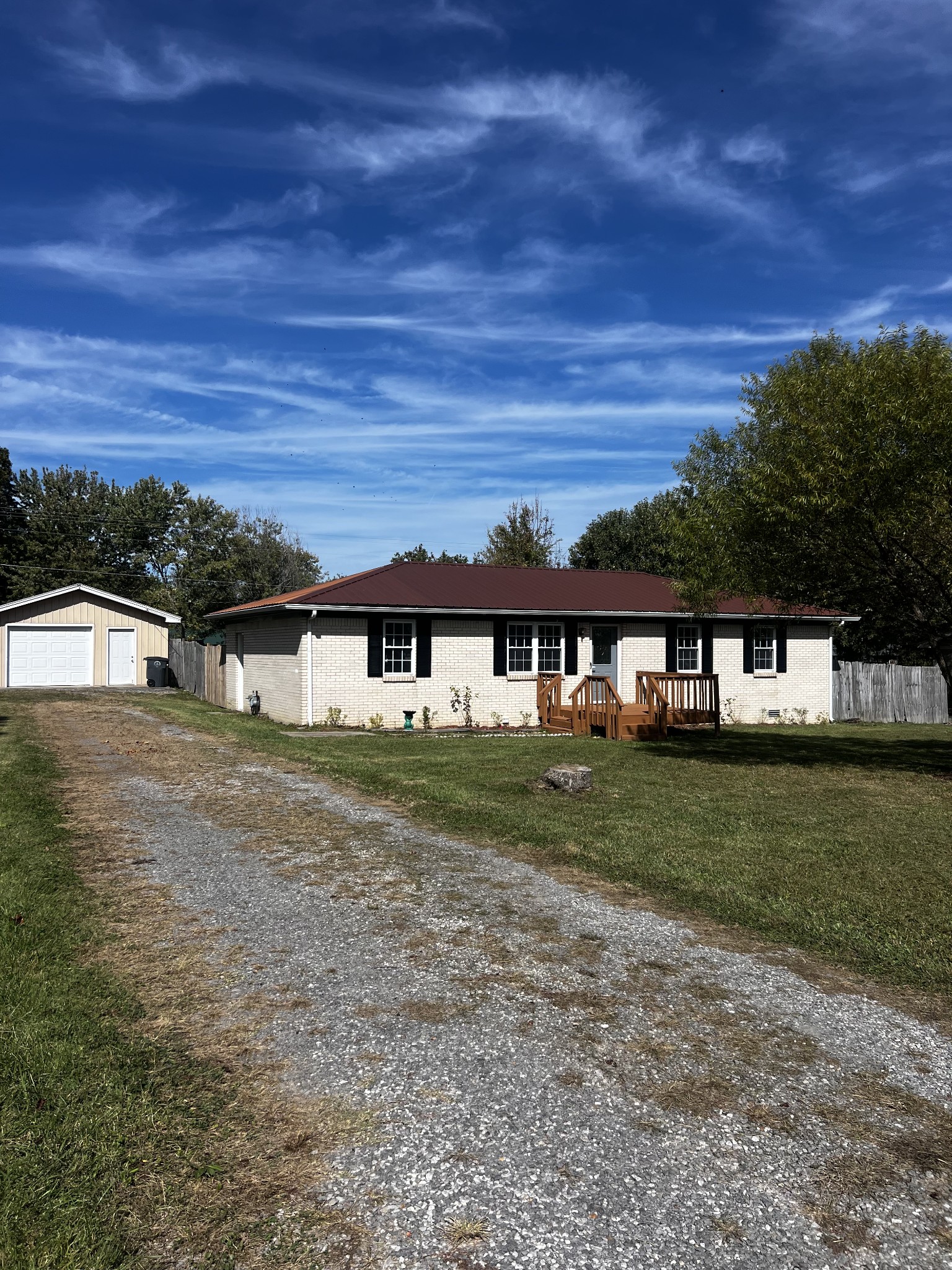 641 Coolidge Road Lafayette, TN 37083 - Photo 17 of 17 a front view of a house with a yard