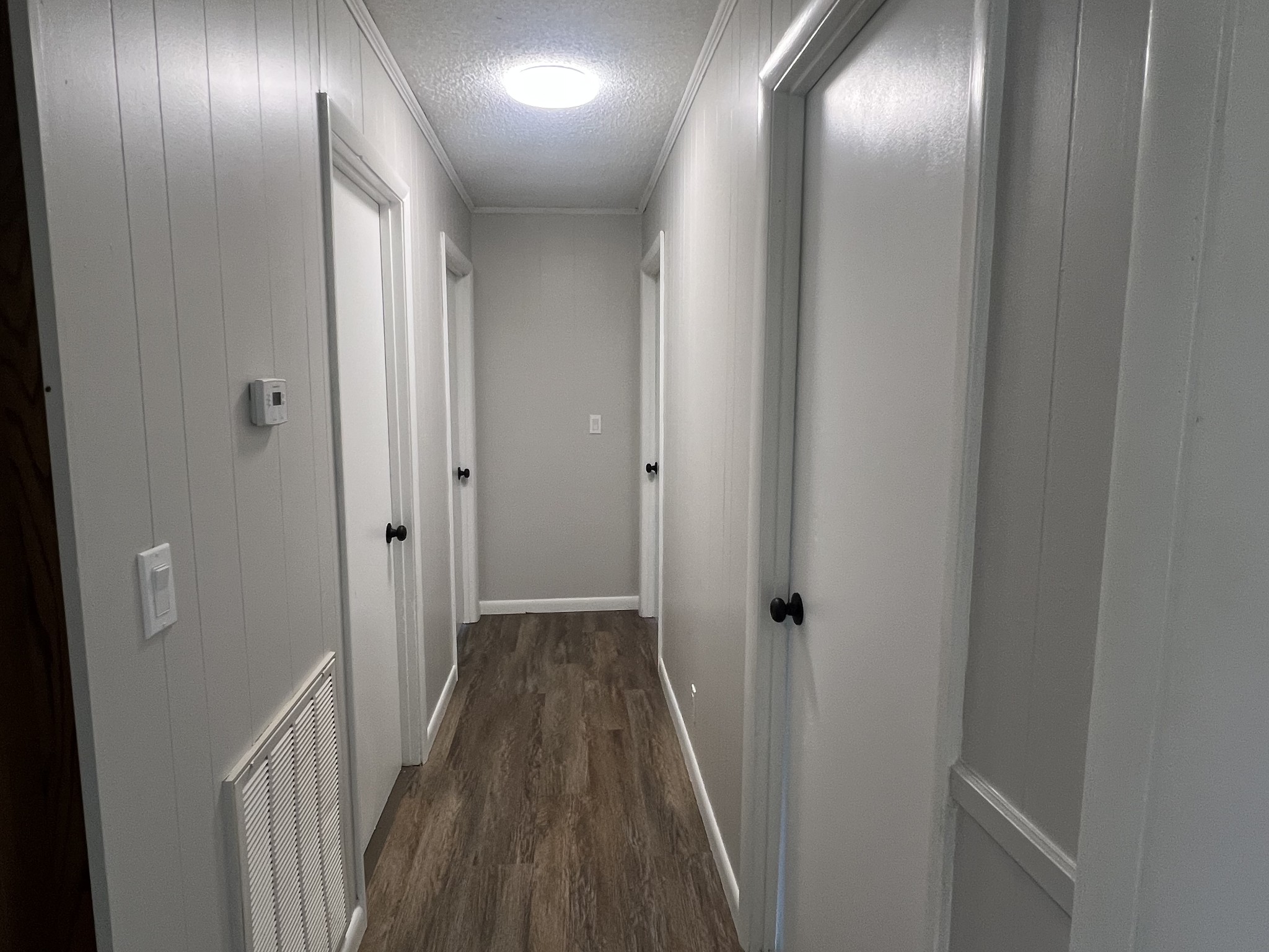 641 Coolidge Road Lafayette, TN 37083 - Photo 9 of 17 a view of a hallway with wooden floor