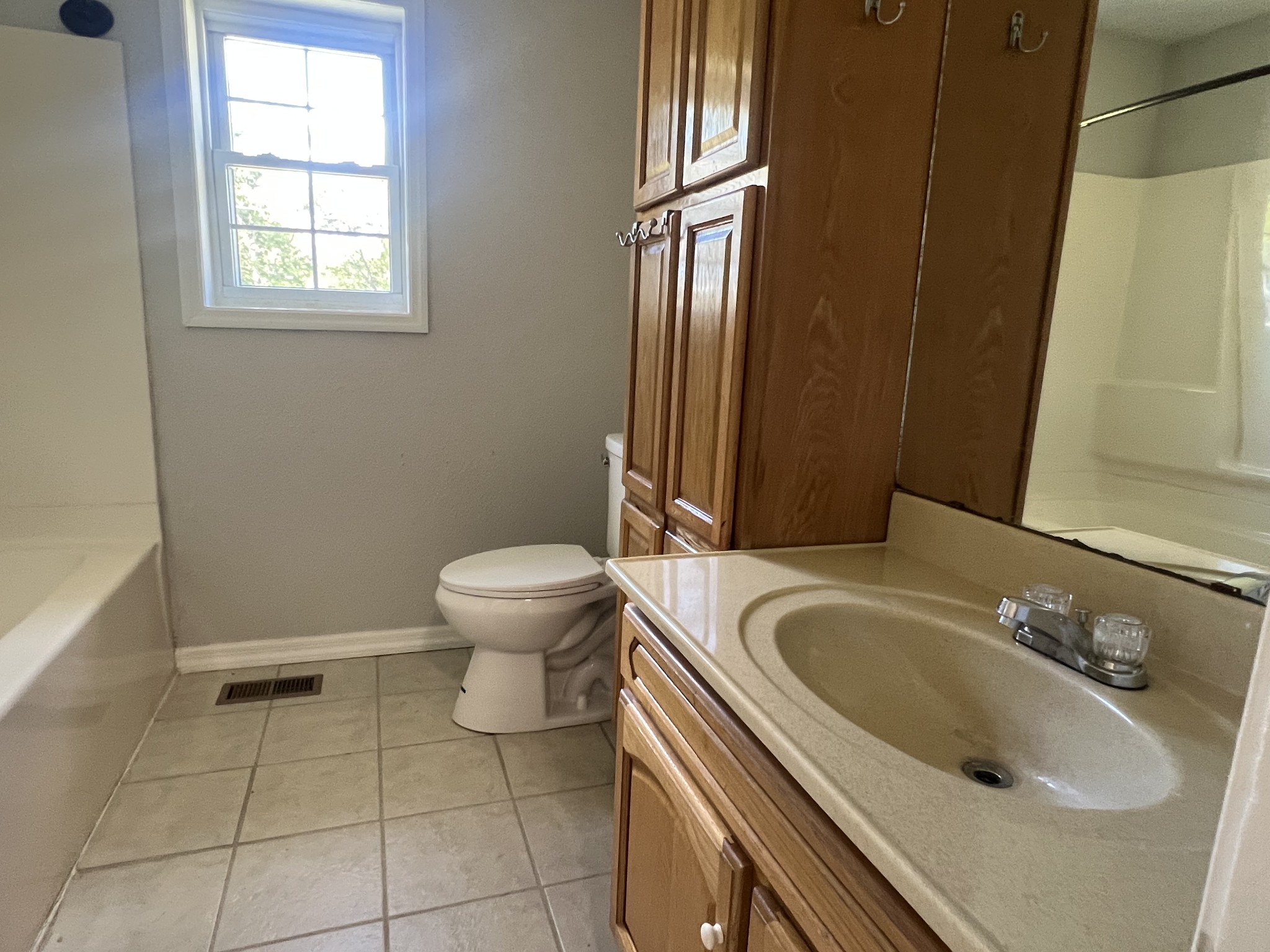641 Coolidge Road Lafayette, TN 37083 - Photo 10 of 17 a bathroom with a sink a toilet and a mirror