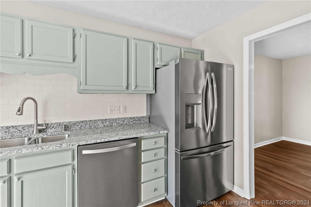 1030 Rim Road Fayetteville, NC 28314 - Photo 16 of 33 a kitchen with stainless steel appliances granite countertop a refrigerator sink and cabinets