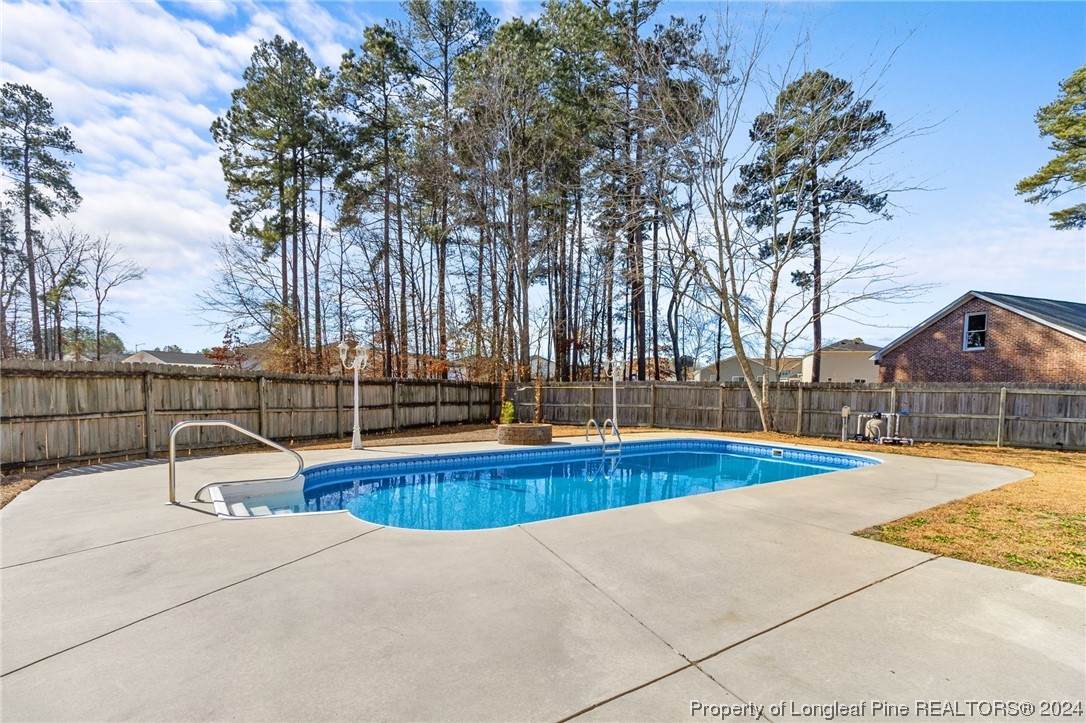 1030 Rim Road Fayetteville, NC 28314 - Photo 32 of 33 a view of a swimming pool with an outdoor space