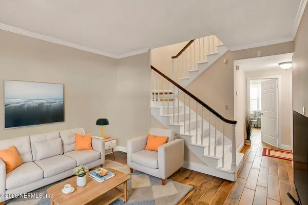 a bedroom with a bed and a potted plant