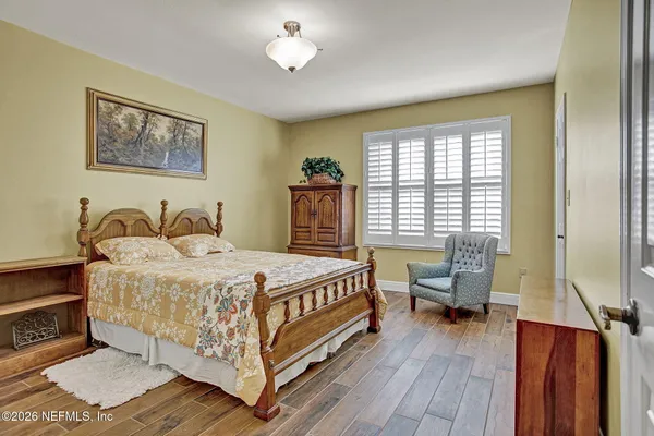 a view of room and window with a ceiling fan
