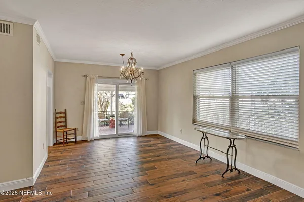 a bathroom with a sink shower and a mirror