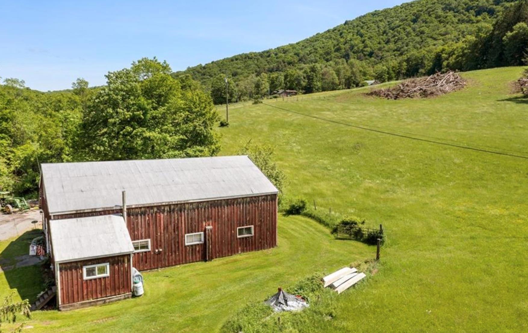 2018 Beaverkill Road Livingston Manor, NY 12758 - Photo 9 of 30 View from above of property with a heavily wooded area