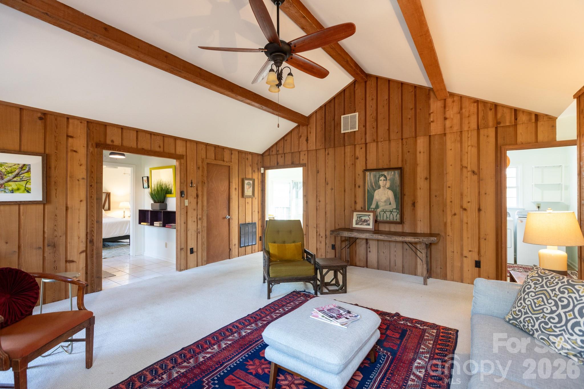 7423 Kuck Road Mint Hill, NC 28227 - Photo 11 of 31 a living room with furniture a rug and a chandelier