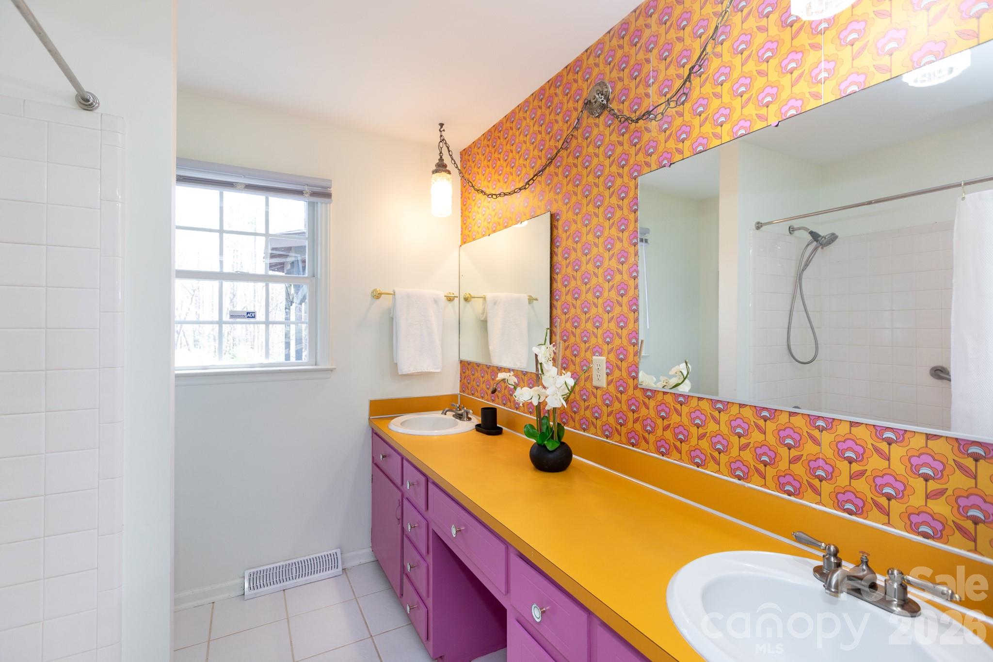 7423 Kuck Road Mint Hill, NC 28227 - Photo 14 of 31 a bathroom with a tub sink and mirror