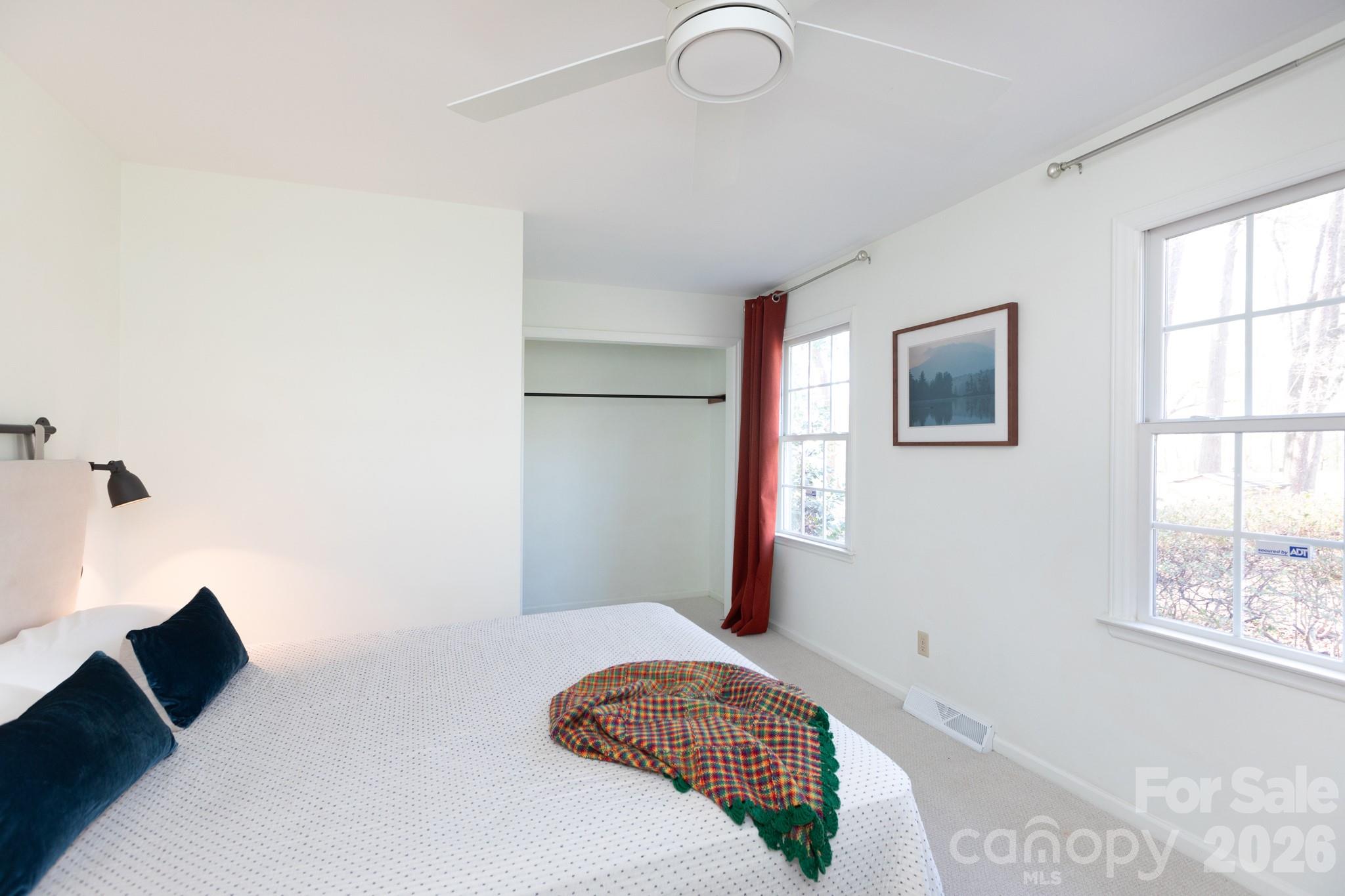 7423 Kuck Road Mint Hill, NC 28227 - Photo 17 of 31 a bedroom with a bed and a window