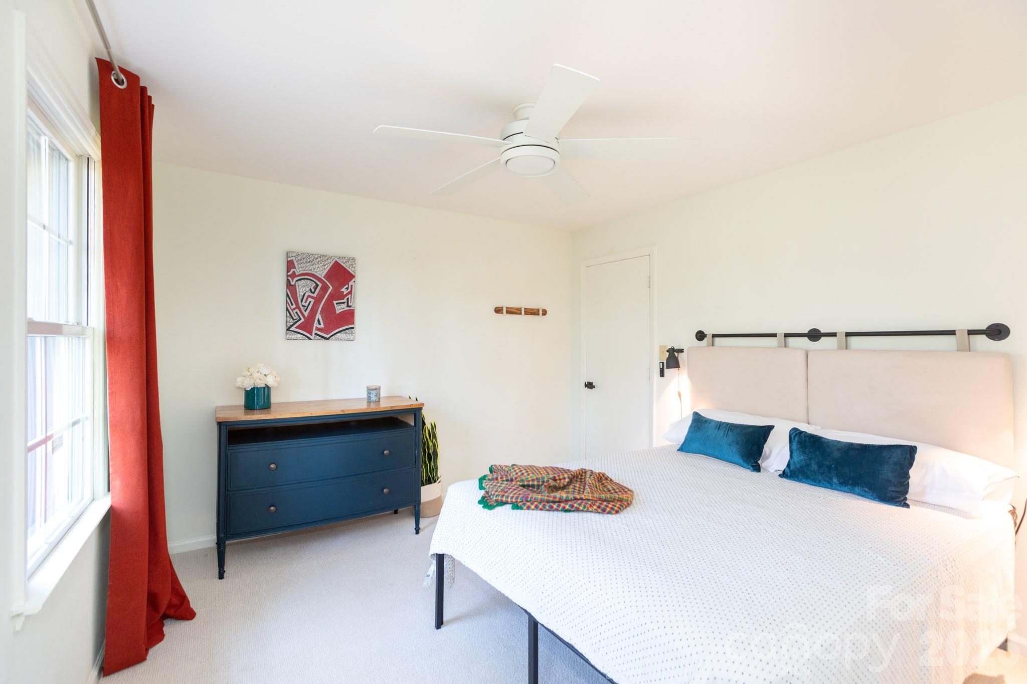 7423 Kuck Road Mint Hill, NC 28227 - Photo 18 of 31 a bedroom with a bed and a desk