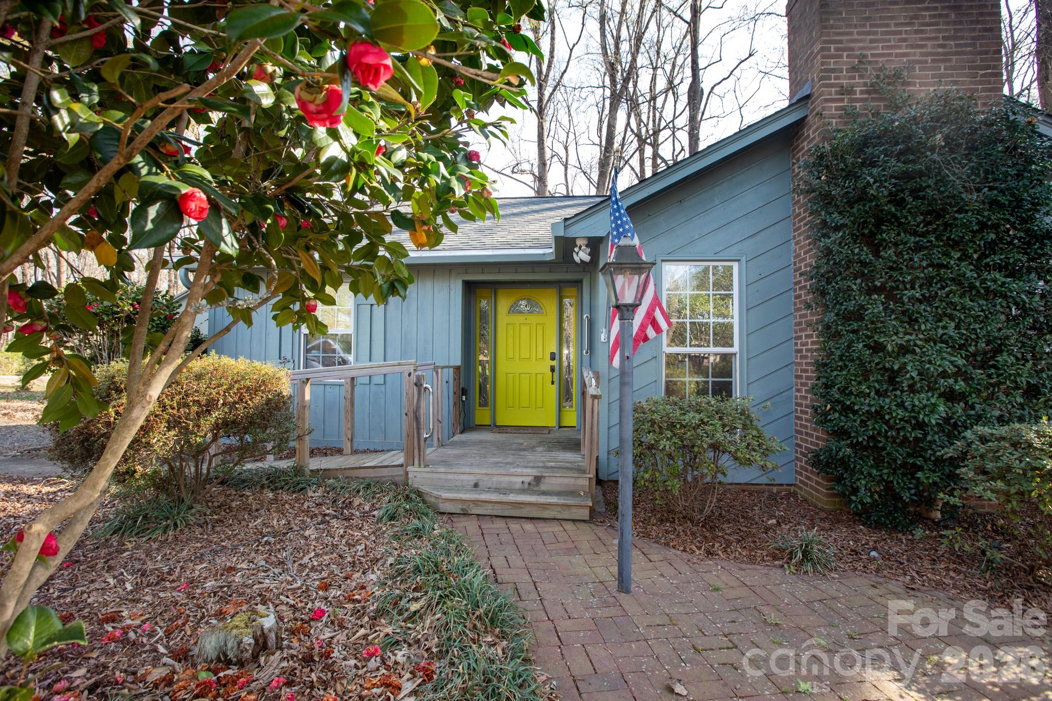 7423 Kuck Road Mint Hill, NC 28227 - Photo 2 of 31 a front view of a house with garden