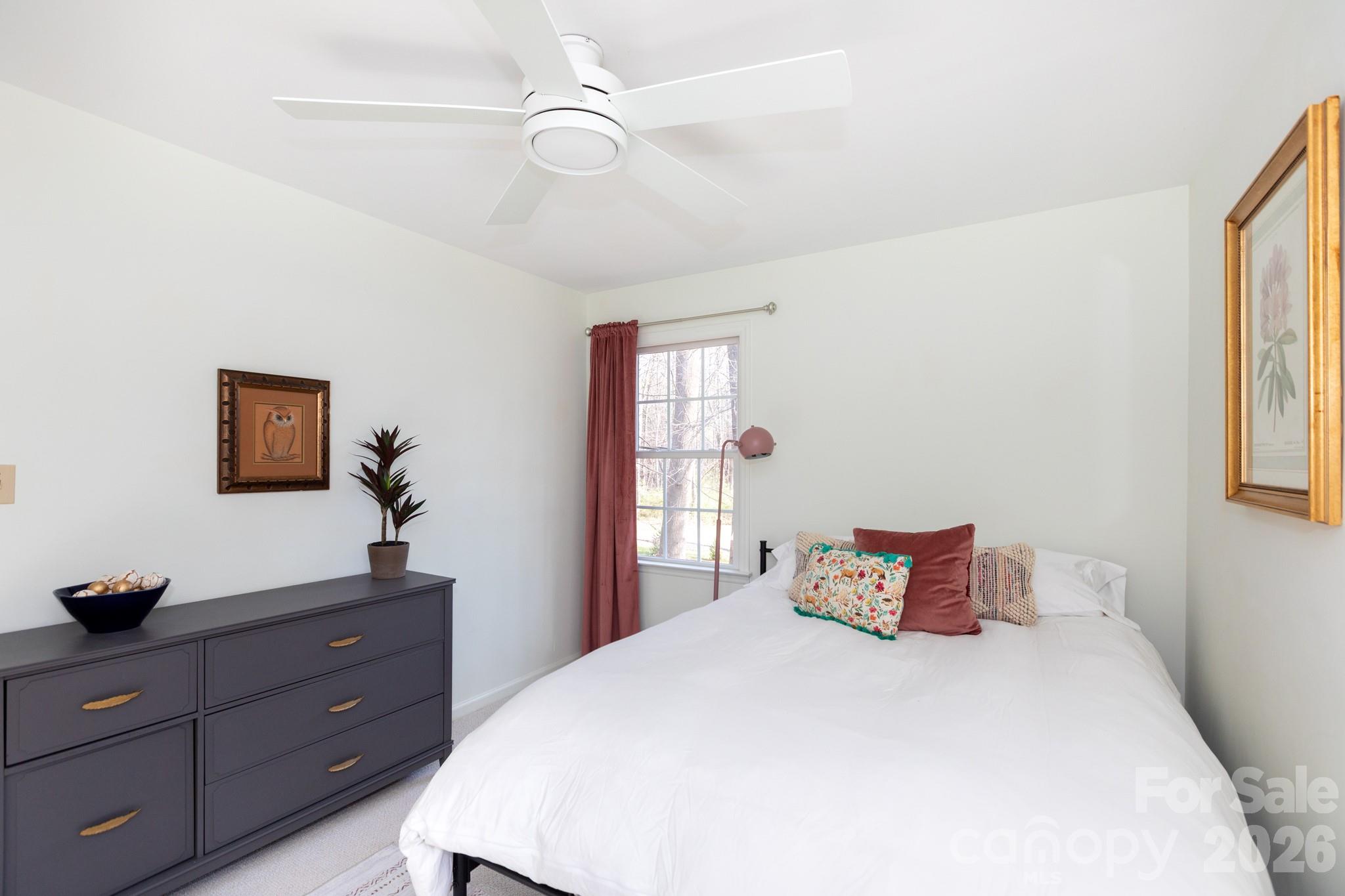 7423 Kuck Road Mint Hill, NC 28227 - Photo 21 of 31 a bedroom with a bed and a window