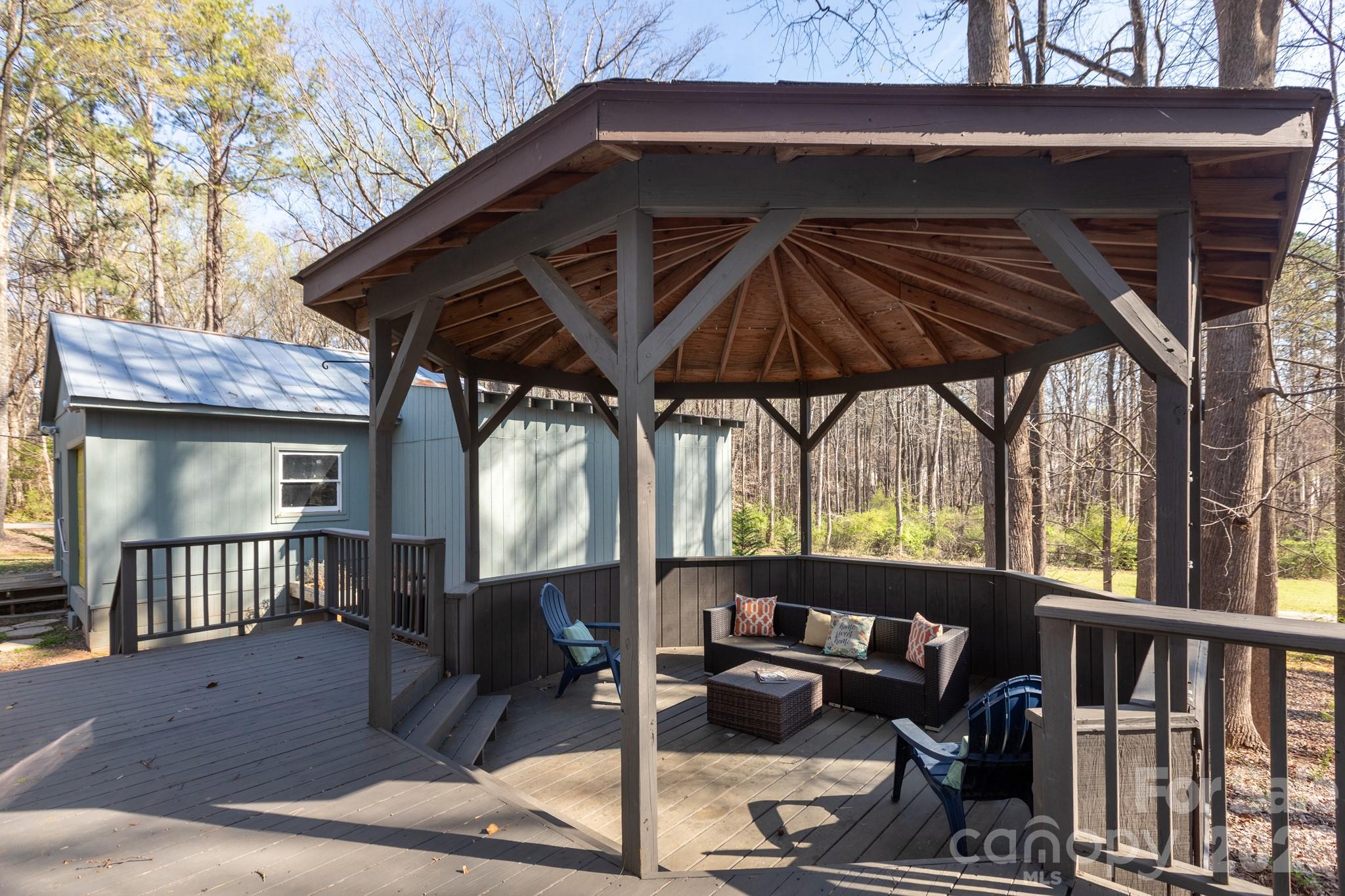 7423 Kuck Road Mint Hill, NC 28227 - Photo 23 of 31 a view of backyard with deck and outdoor seating