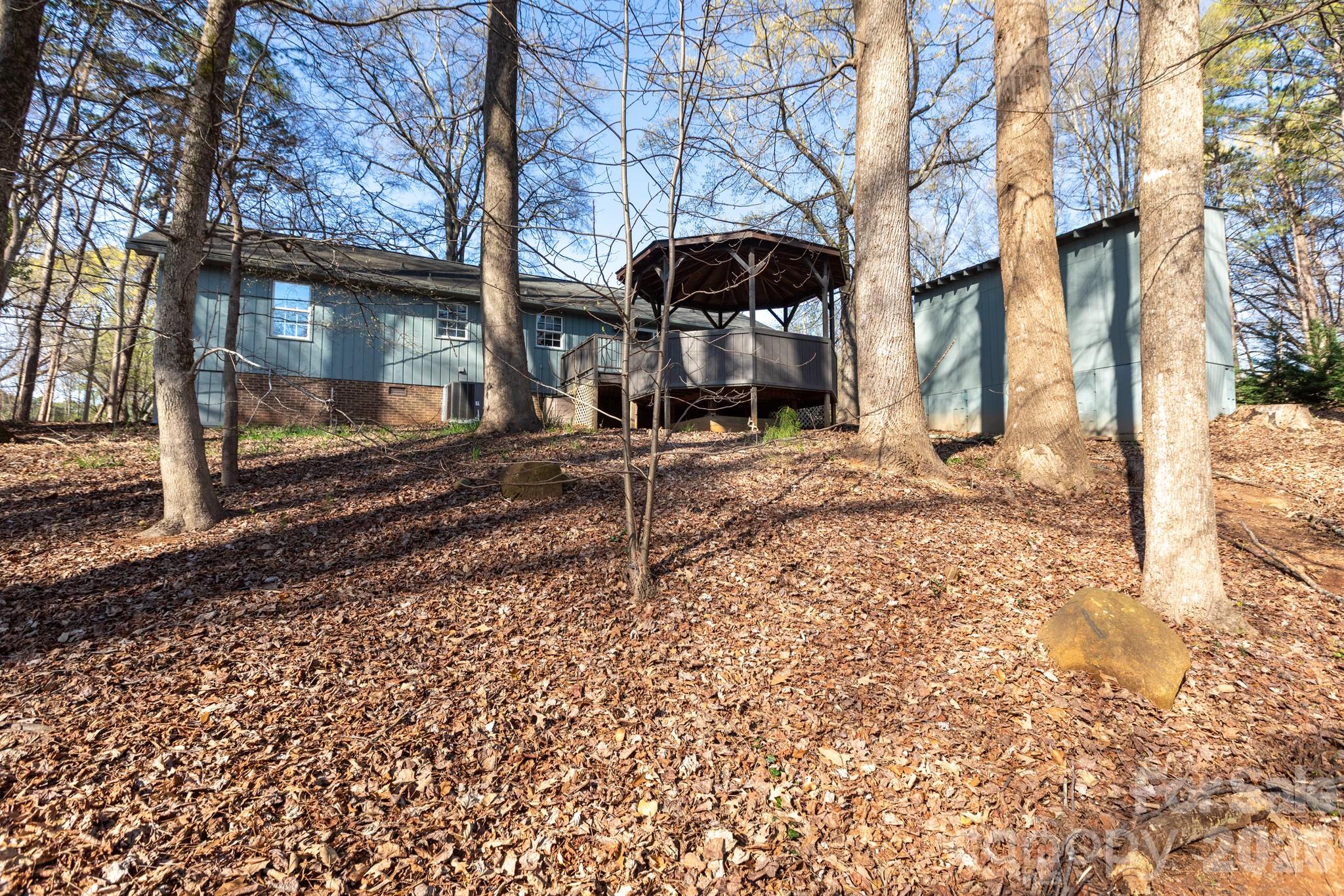 7423 Kuck Road Mint Hill, NC 28227 - Photo 26 of 31 a front view of a house with yard and seating