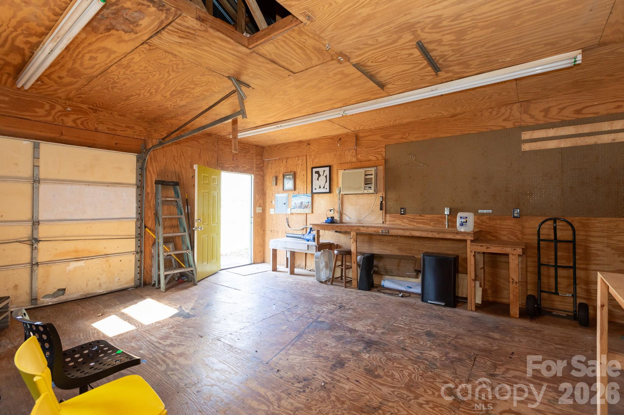 7423 Kuck Road Mint Hill, NC 28227 - Photo 29 of 31 a view of a livingroom with furniture a ceiling fan and front door