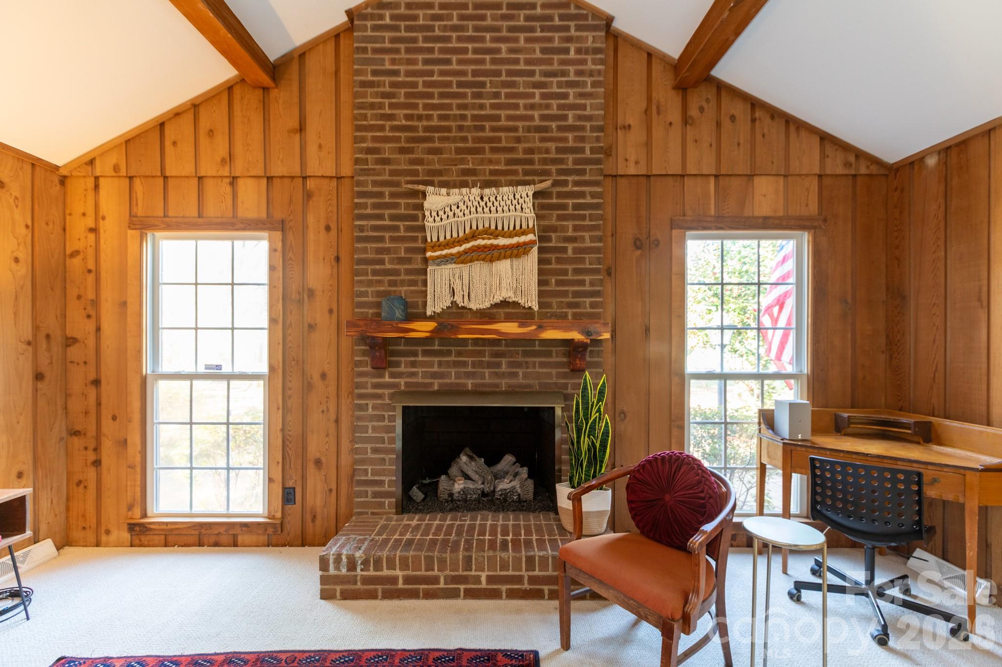 7423 Kuck Road Mint Hill, NC 28227 - Photo 5 of 31 a living room with furniture a rug and a fireplace