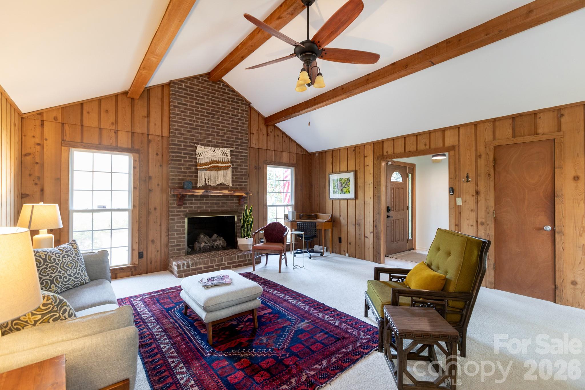 7423 Kuck Road Mint Hill, NC 28227 - Photo 6 of 31 a living room with furniture and a fireplace