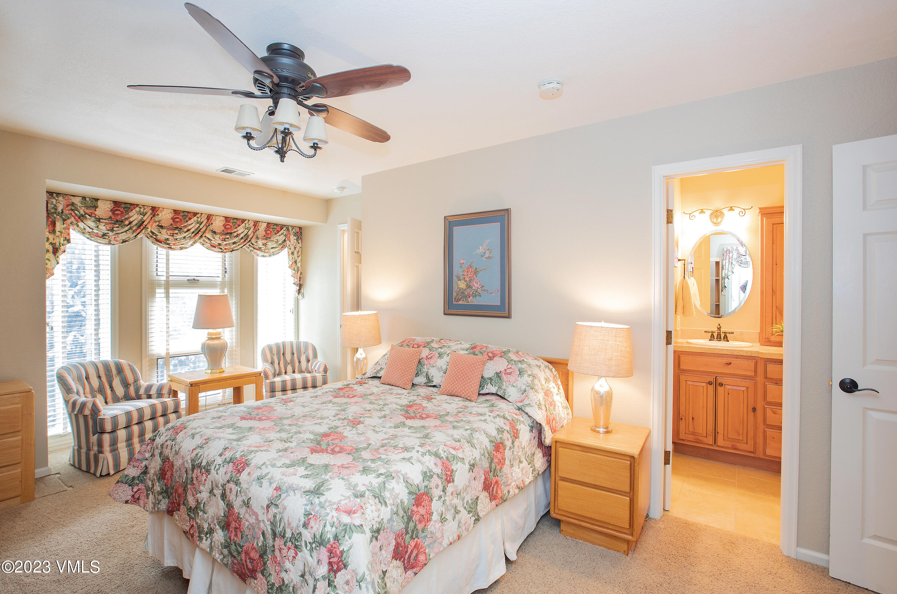 10 Stetson Drive, Unit A Edwards, CO 81632 - Photo 20 of 26 a bedroom with a large bed and a chandelier