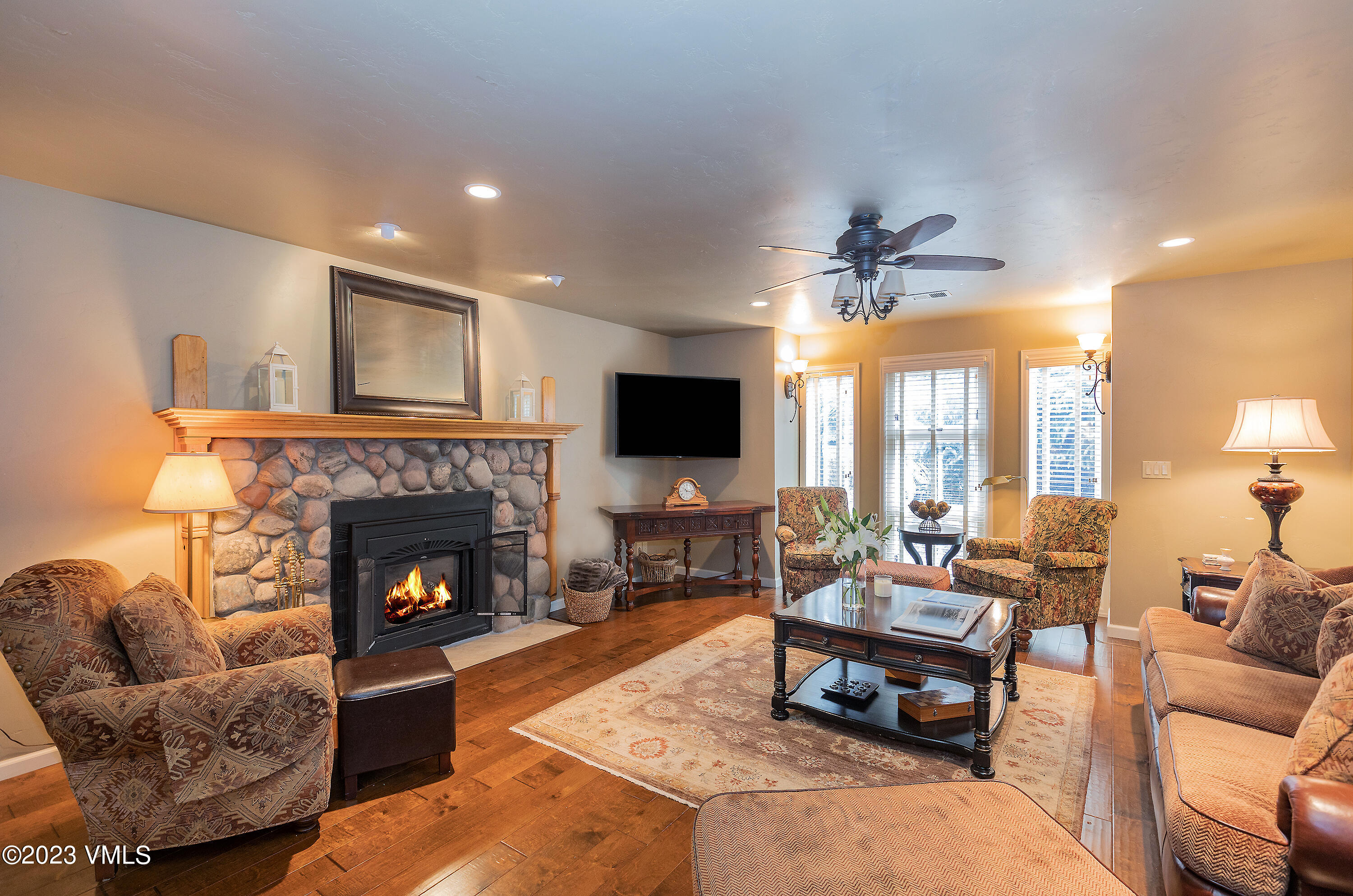 10 Stetson Drive, Unit A Edwards, CO 81632 - Photo 2 of 26 a living room with furniture a flat screen tv and a fireplace