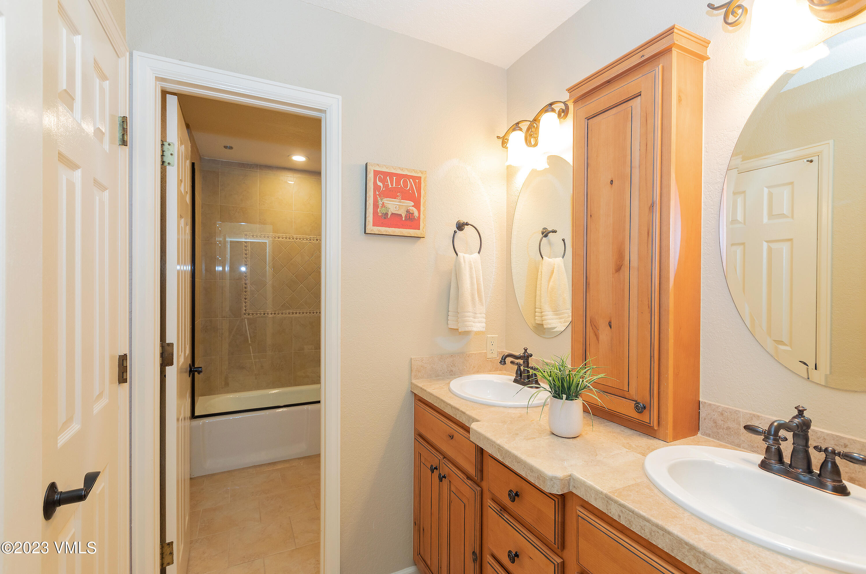 10 Stetson Drive, Unit A Edwards, CO 81632 - Photo 22 of 26 a bathroom with a granite countertop sink shower and a mirror