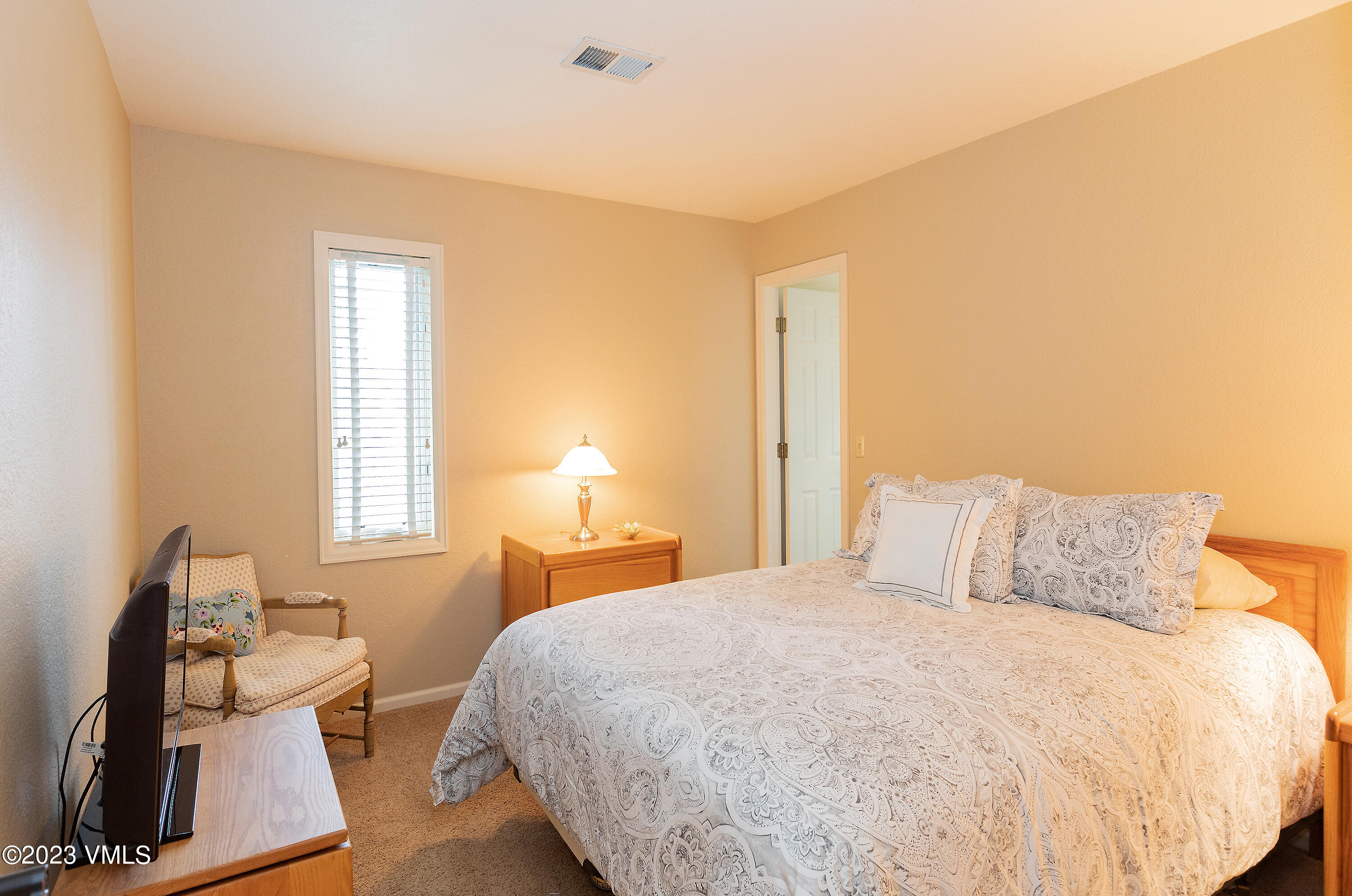 10 Stetson Drive, Unit A Edwards, CO 81632 - Photo 24 of 26 a bedroom with a bed and wooden floor