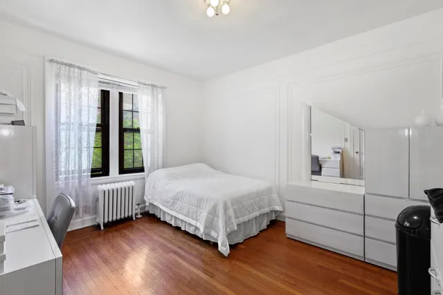 a bed room with a bed and a window