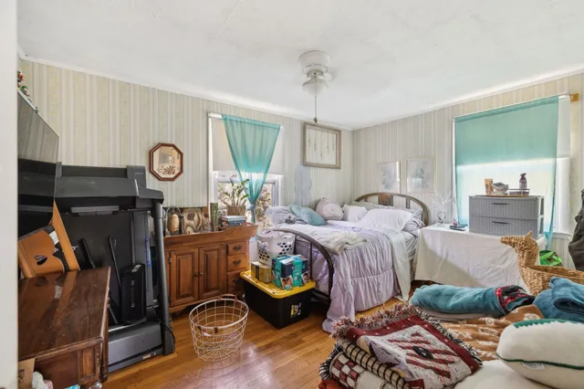 a bedroom with bed and a window