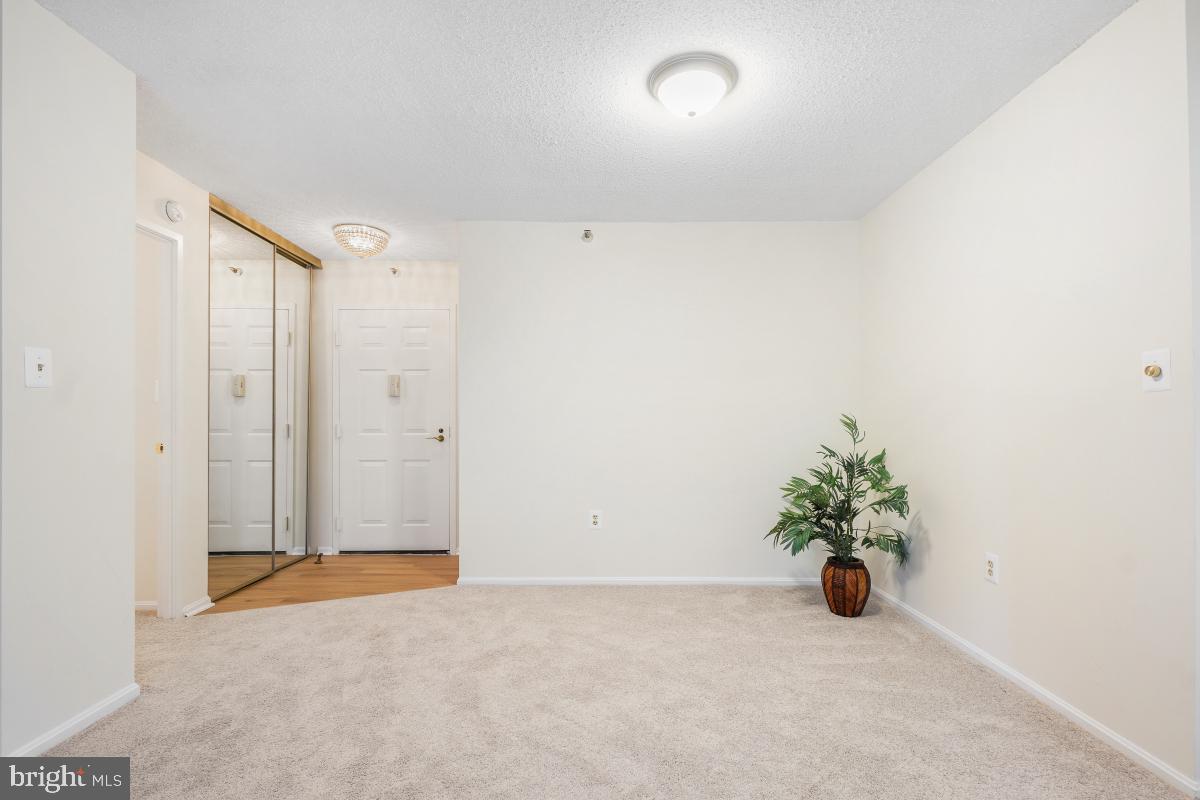 15107 Interlachen Drive, Unit 2321 Silver Spring, MD 20906 - Photo 12 of 35 an empty room with potted plants