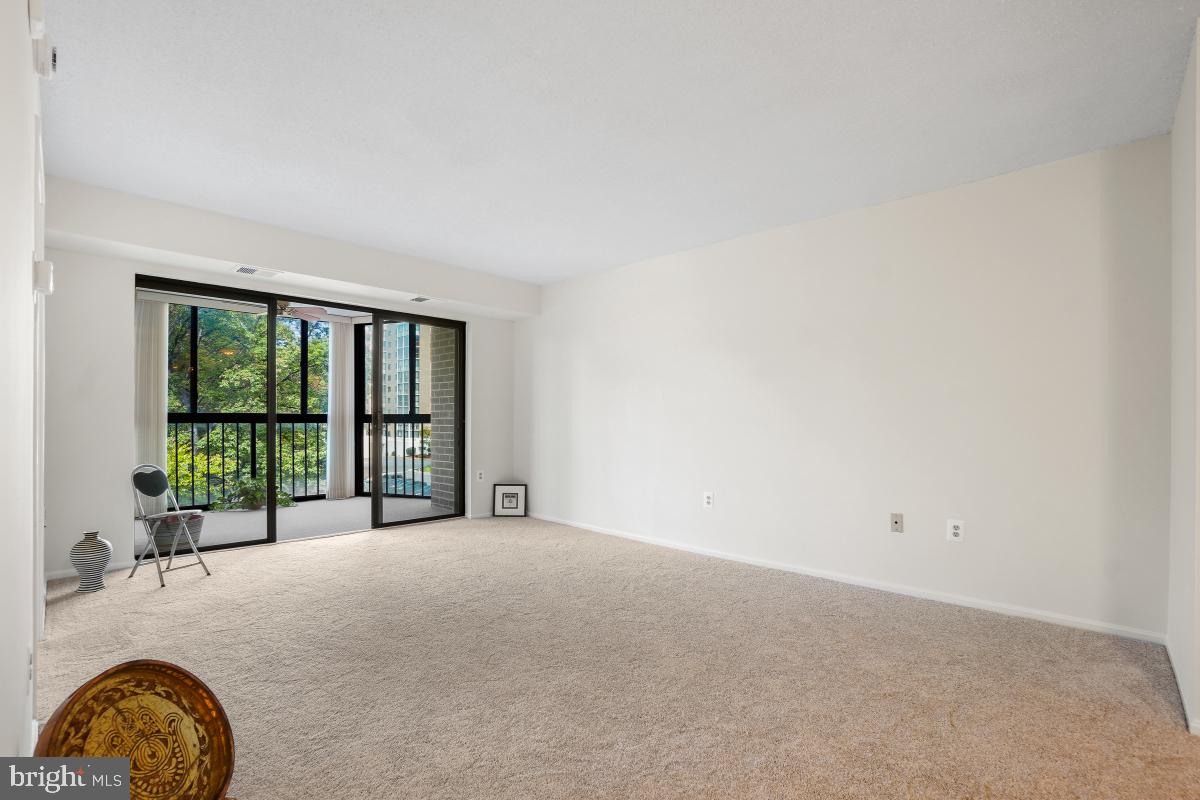 15107 Interlachen Drive, Unit 2321 Silver Spring, MD 20906 - Photo 16 of 35 a view of an empty room with a window