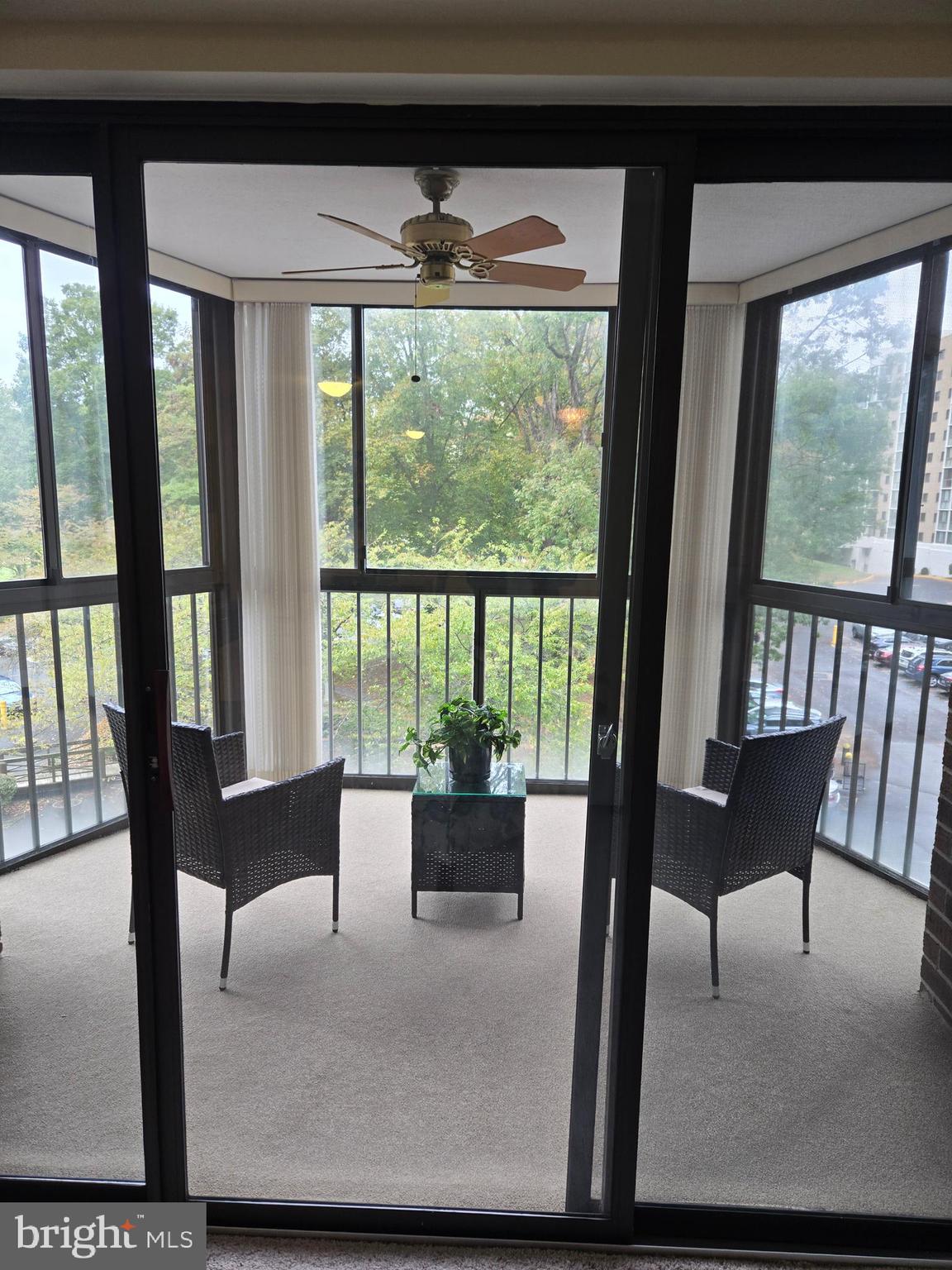 15107 Interlachen Drive, Unit 2321 Silver Spring, MD 20906 - Photo 2 of 35 a living room with furniture and a floor to ceiling window