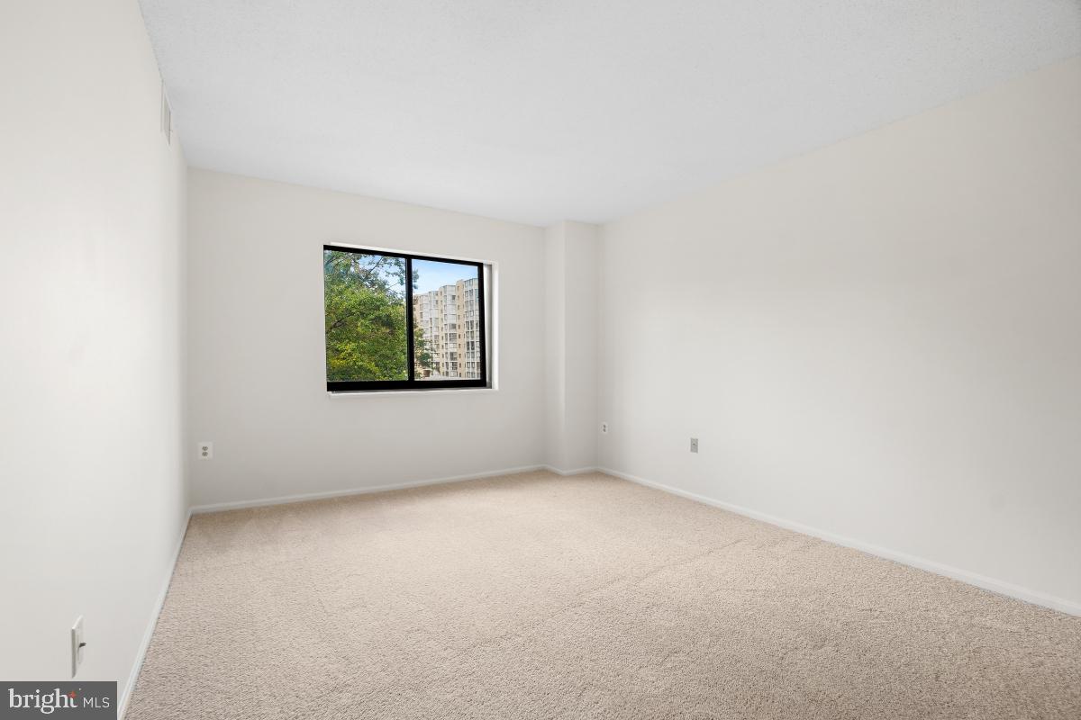 15107 Interlachen Drive, Unit 2321 Silver Spring, MD 20906 - Photo 23 of 35 an empty room with windows