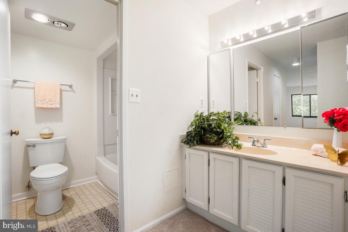 15107 Interlachen Drive, Unit 2321 Silver Spring, MD 20906 - Photo 26 of 35 a bathroom with a sink and a toilet