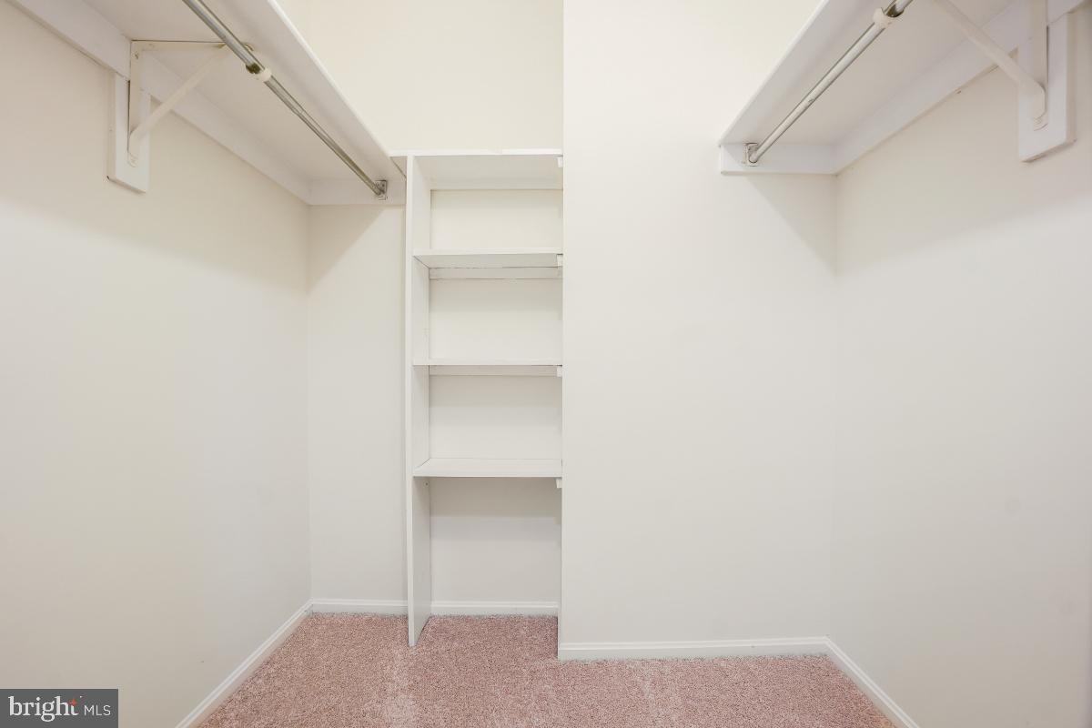 15107 Interlachen Drive, Unit 2321 Silver Spring, MD 20906 - Photo 29 of 35 a view of an empty walk in closet