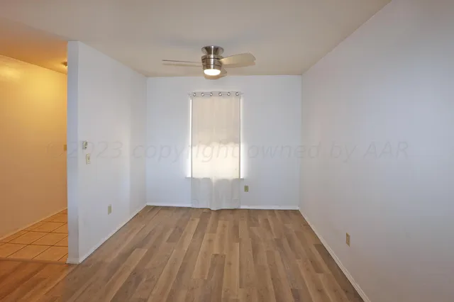 a kitchen with stainless steel appliances granite countertop a refrigerator a sink a stove and island