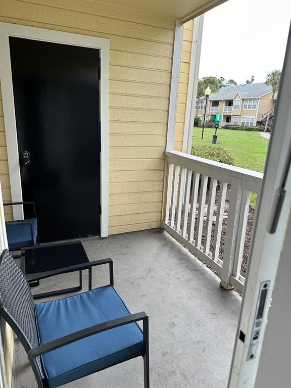 1057 South Hiawassee Road, Unit 1918 Orlando, FL 32835 - Photo 14 of 26 a view of a porch with furniture