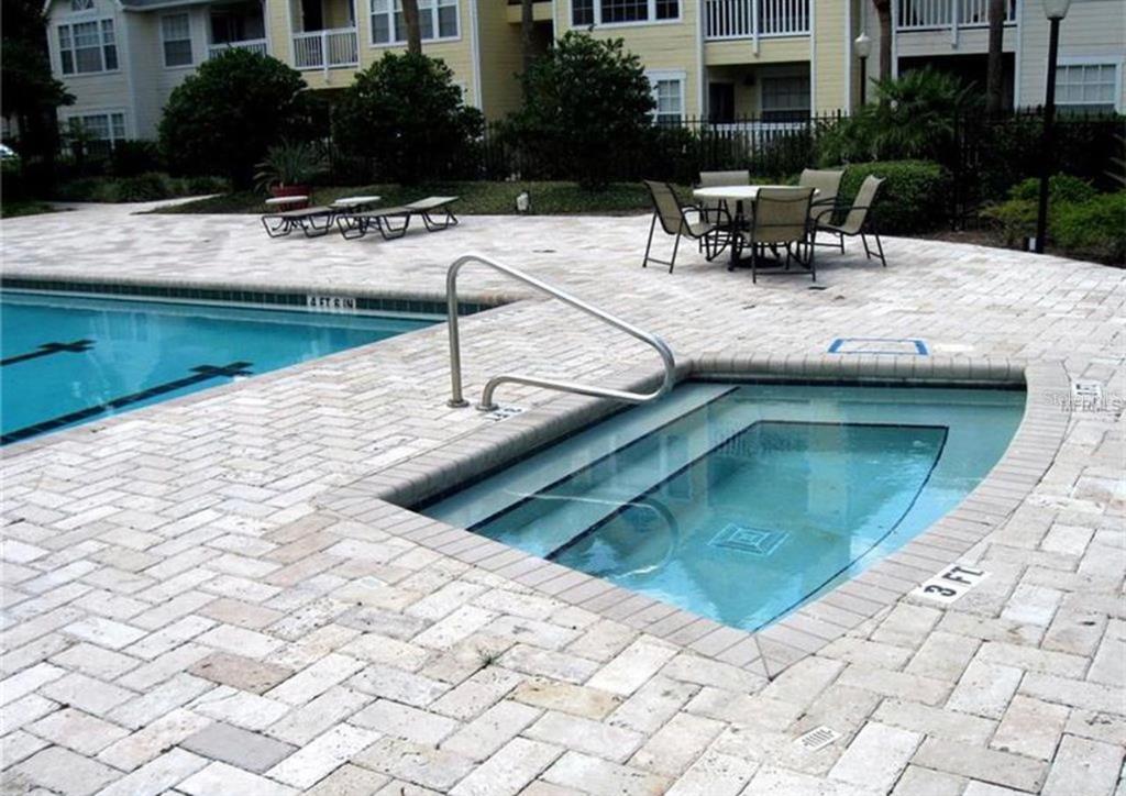 1057 South Hiawassee Road, Unit 1918 Orlando, FL 32835 - Photo 22 of 26 a view of swimming pool with outdoor seating
