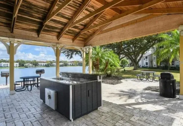 a patio with a table and chairs
