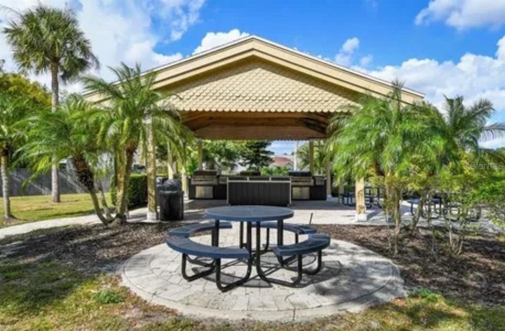 1057 South Hiawassee Road, Unit 1918 Orlando, FL 32835 - Photo 26 of 26 a patio with a table and chairs