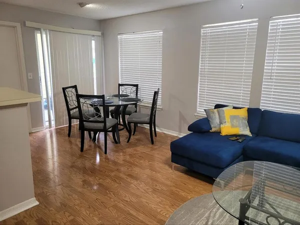 a kitchen with a sink and a microwave
