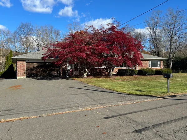 a view of a house with a yard