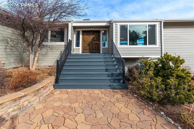 a view of a balcony with wooden floor