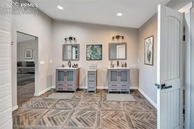 a bedroom with a large bed and a couch