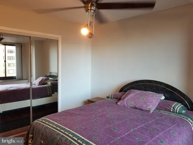 a bedroom with a bed and a dresser