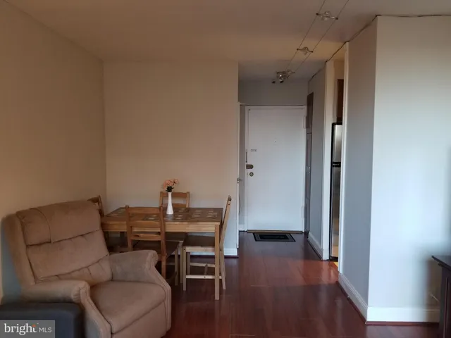 a view of a livingroom with furniture and wooden floor