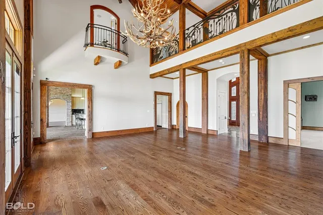 a view of an entryway with wooden floor and windows