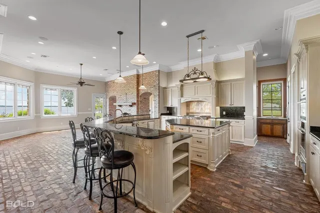 a kitchen with a stove a table and chairs
