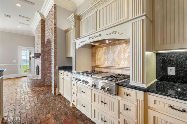 a kitchen with stainless steel appliances a stove and a refrigerator