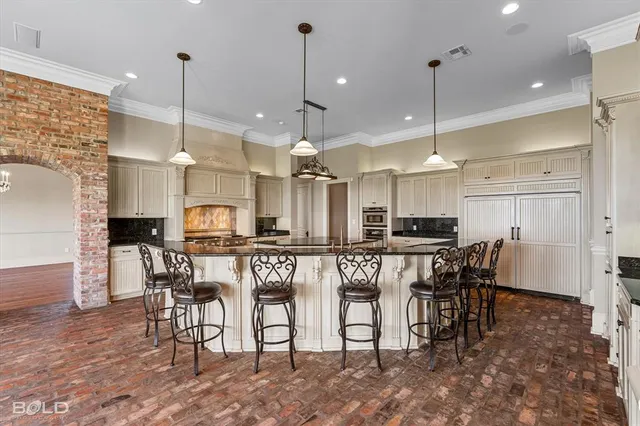 a large kitchen with a table and chairs