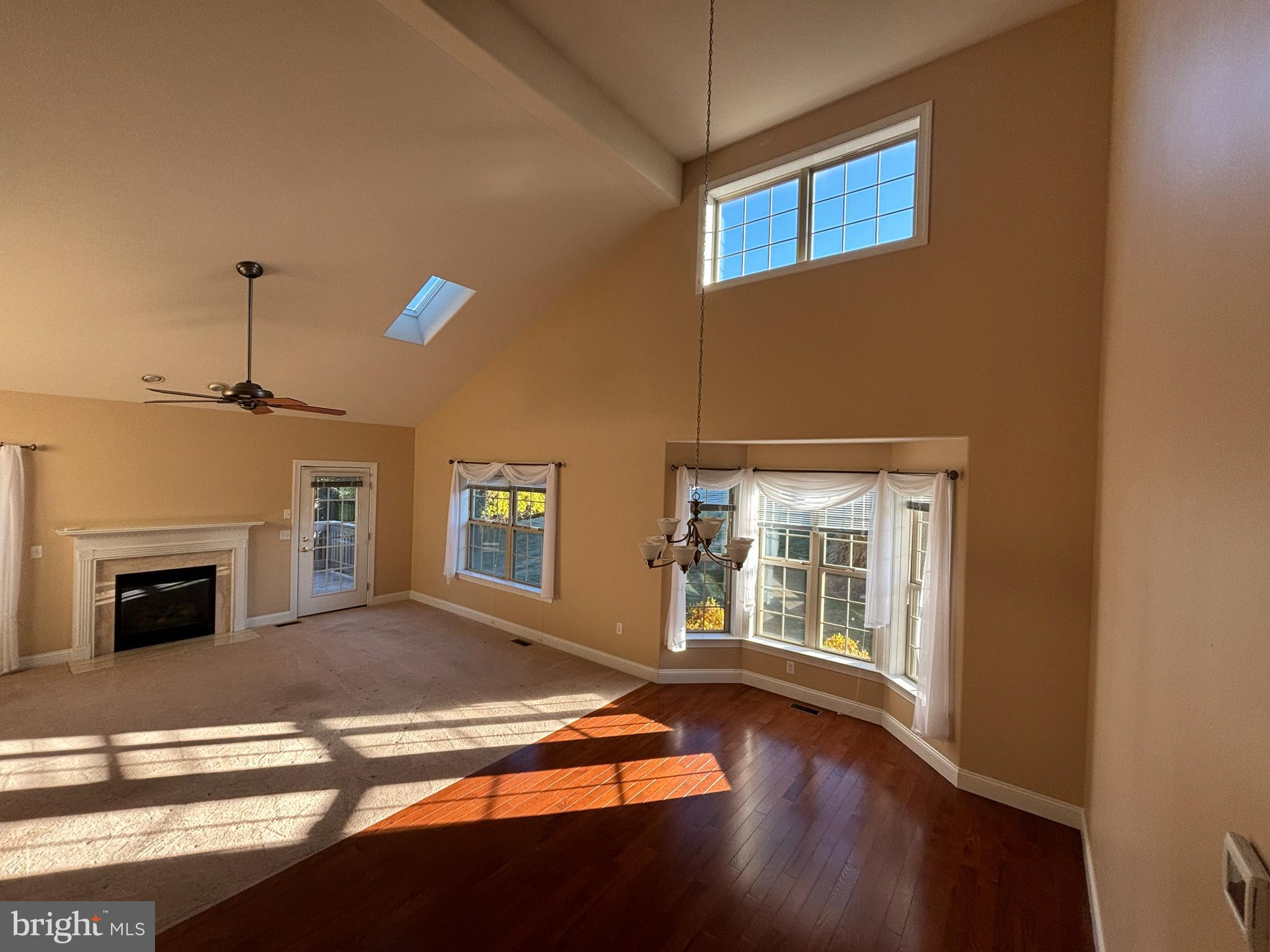 4300 North Victoria Way Harrisburg, PA 17112 - Photo 14 of 41 a view of a livingroom with wooden floor and a fireplace